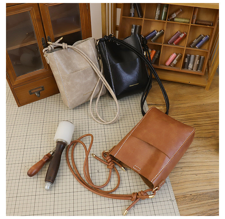 Handmade material bag fashionable and simple solid color bucket messenger bag