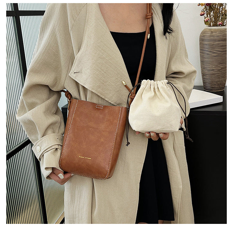 Handmade material bag fashionable and simple solid color bucket messenger bag