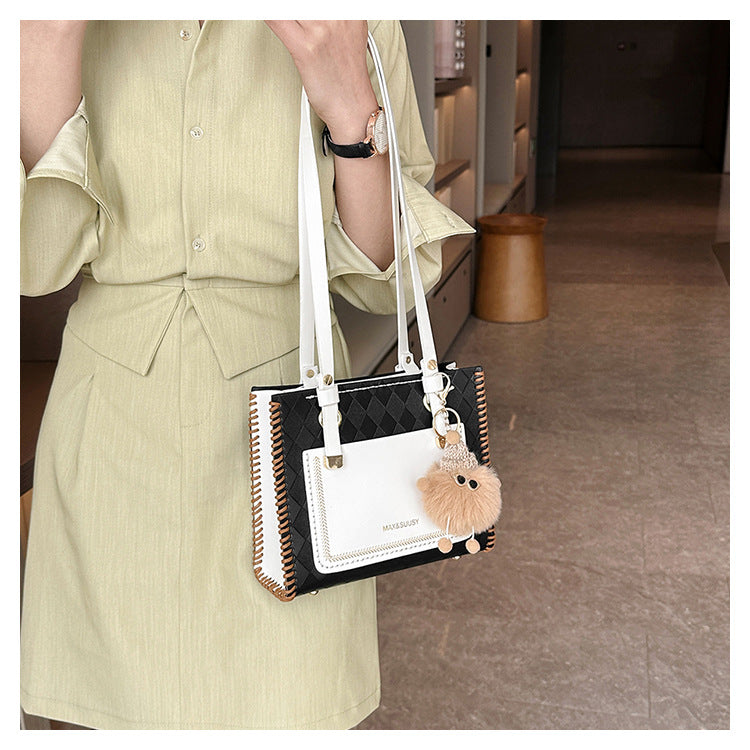 Experience fashion and style with our handmade geometric color-blocked mini bag