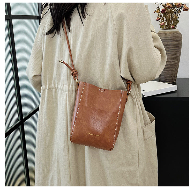 Handmade material bag fashionable and simple solid color bucket messenger bag