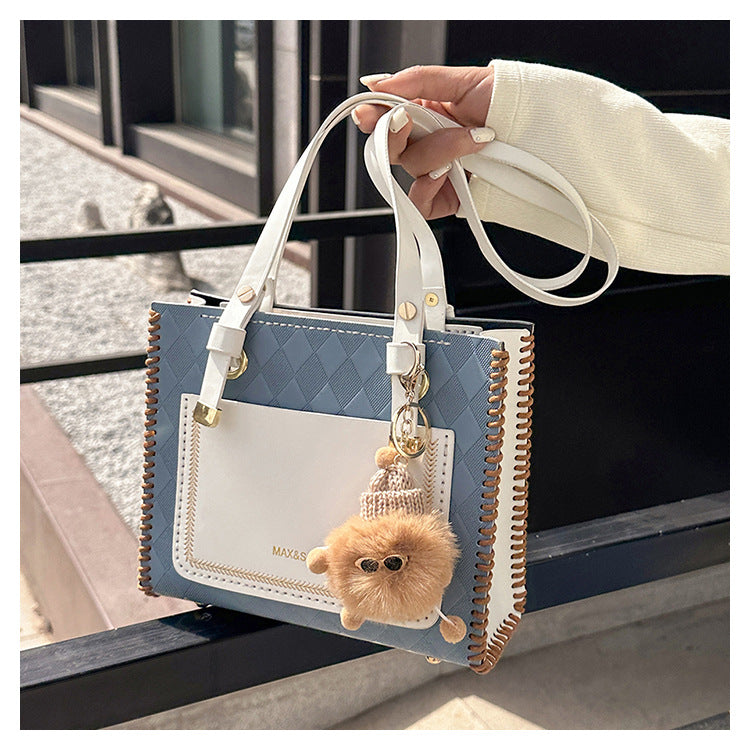 Experience fashion and style with our handmade geometric color-blocked mini bag