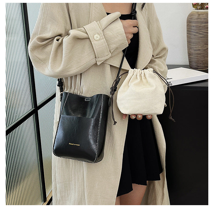 Handmade material bag fashionable and simple solid color bucket messenger bag