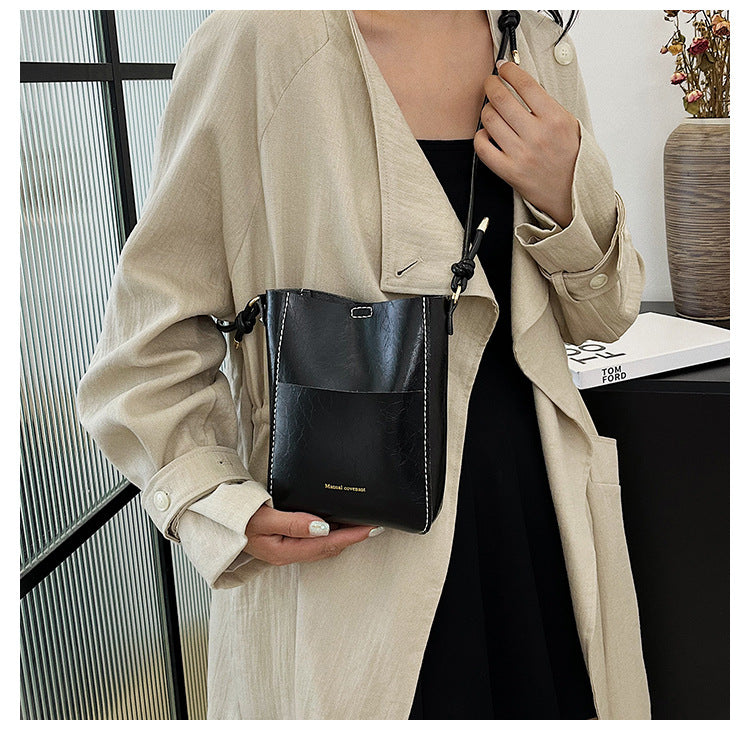 Handmade material bag fashionable and simple solid color bucket messenger bag