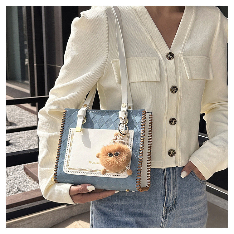 Experience fashion and style with our handmade geometric color-blocked mini bag