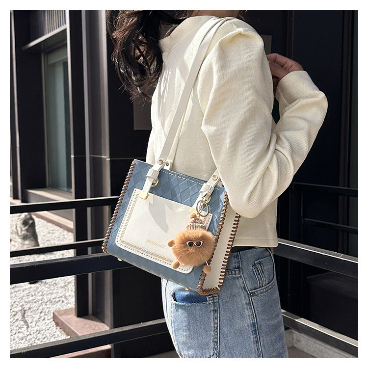 Experience fashion and style with our handmade geometric color-blocked mini bag