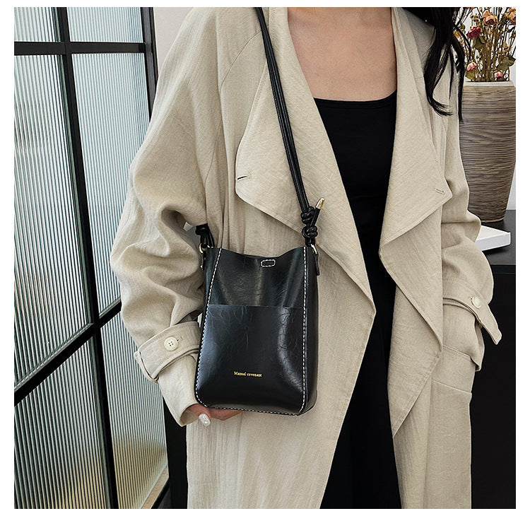 Handmade material bag fashionable and simple solid color bucket messenger bag