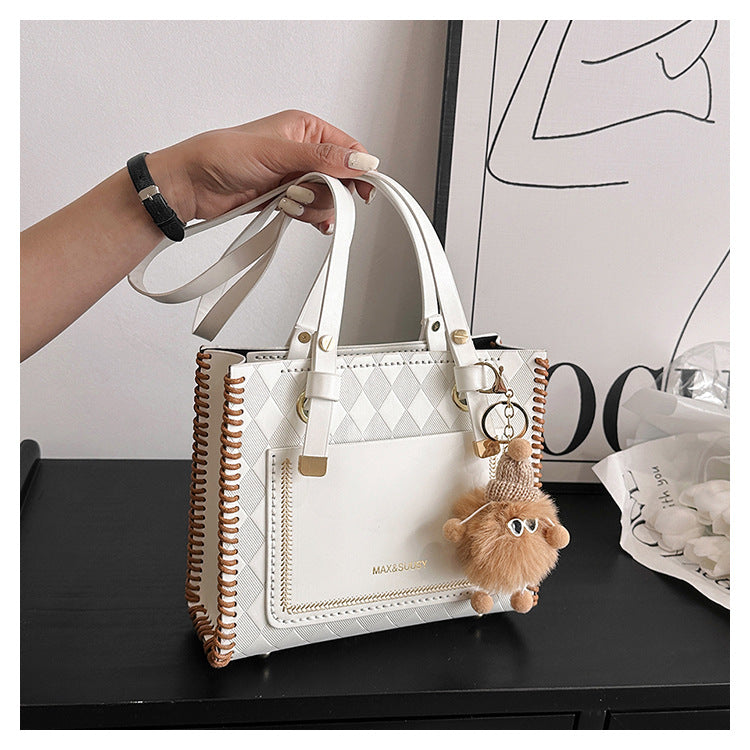 Experience fashion and style with our handmade geometric color-blocked mini bag