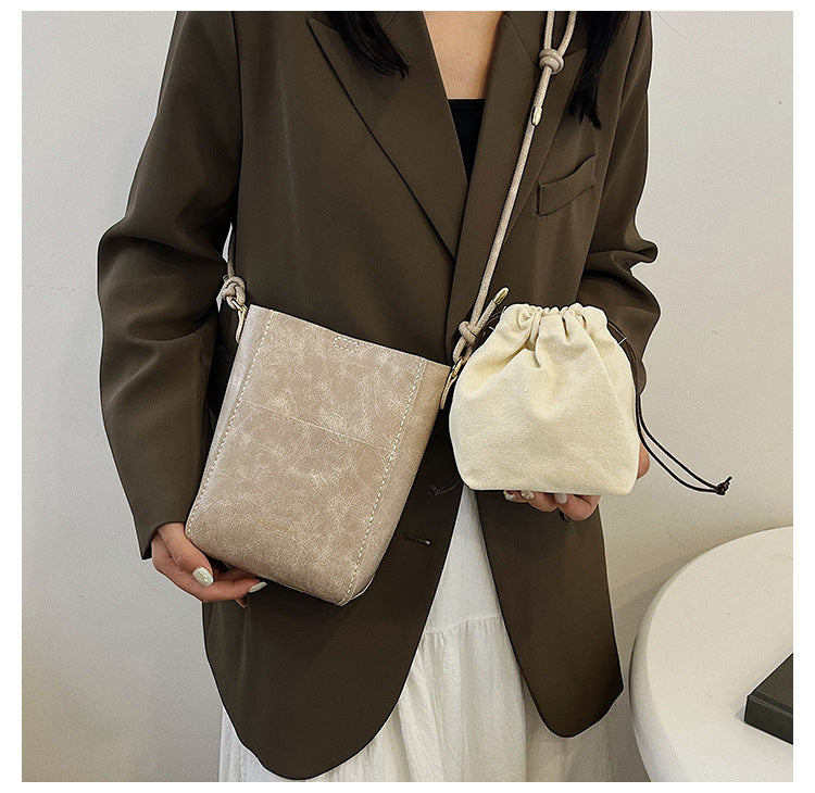 Handmade material bag fashionable and simple solid color bucket messenger bag