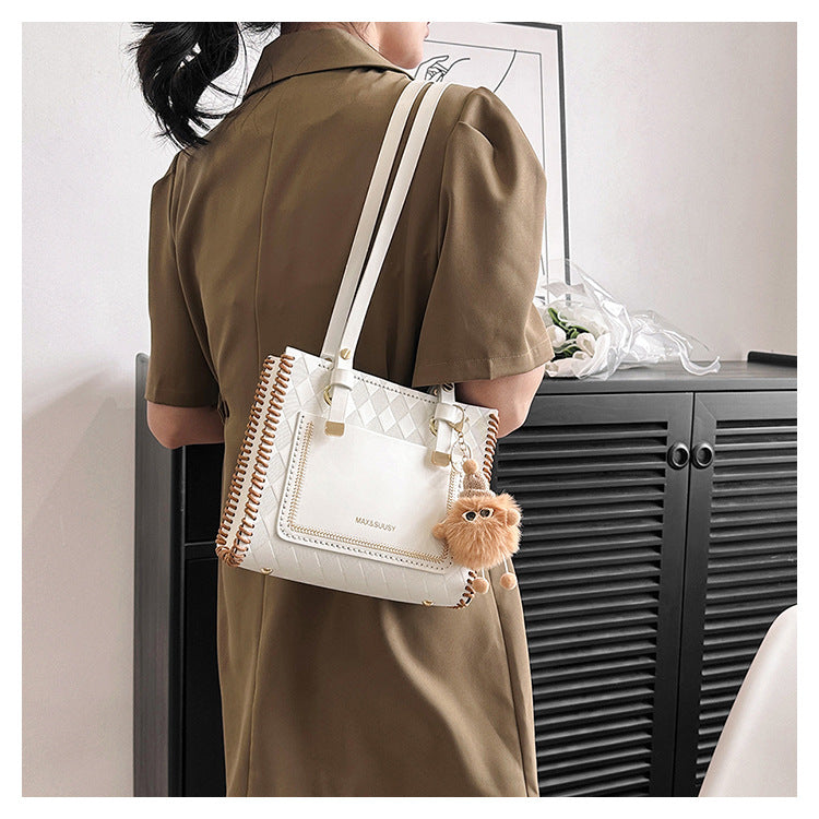 Experience fashion and style with our handmade geometric color-blocked mini bag