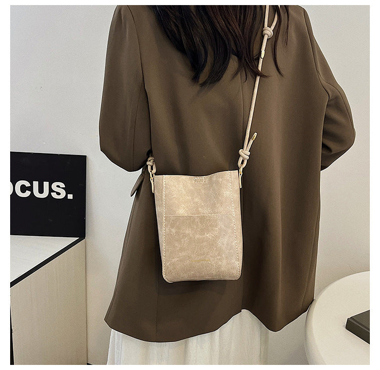 Handmade material bag fashionable and simple solid color bucket messenger bag