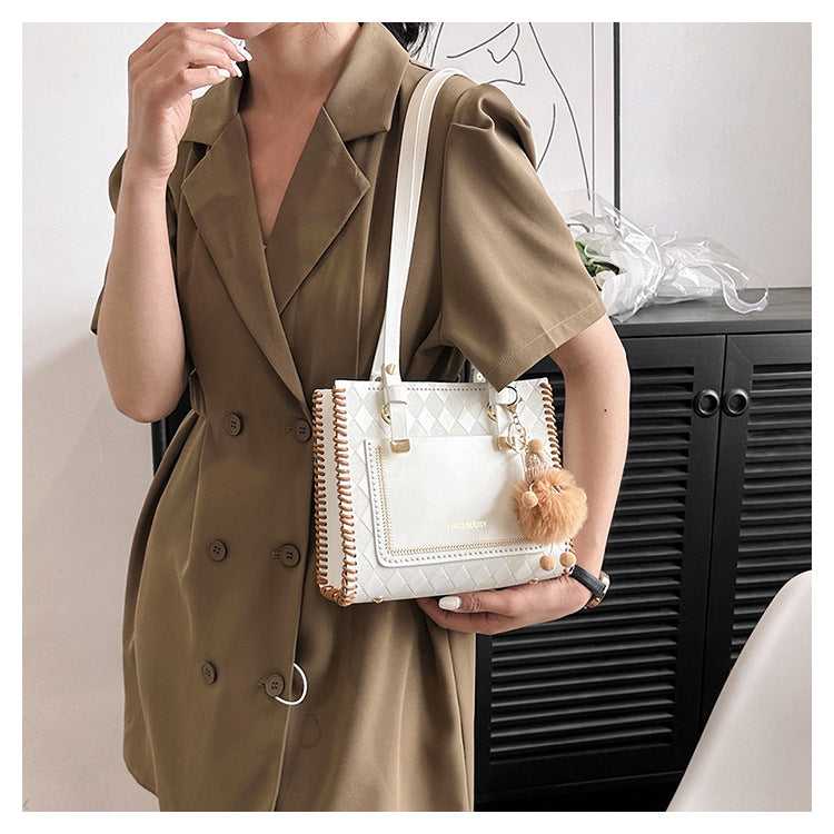 Experience fashion and style with our handmade geometric color-blocked mini bag