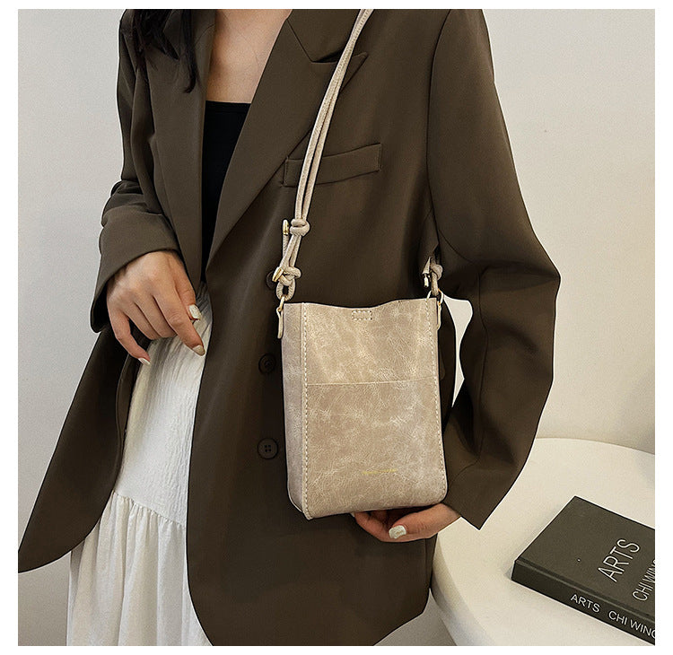 Handmade material bag fashionable and simple solid color bucket messenger bag