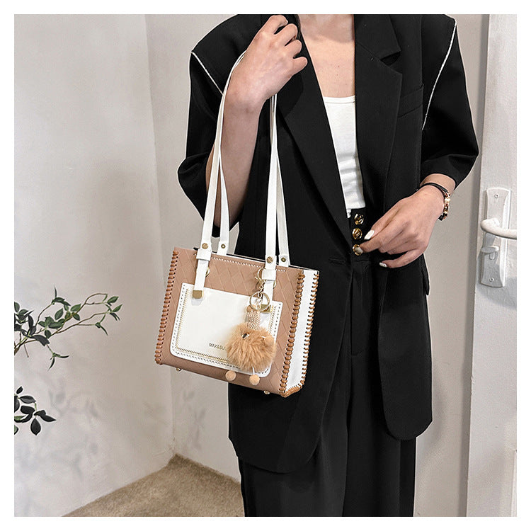 Experience fashion and style with our handmade geometric color-blocked mini bag