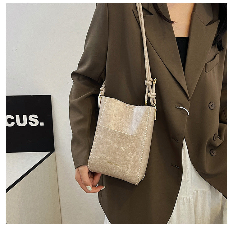 Handmade material bag fashionable and simple solid color bucket messenger bag