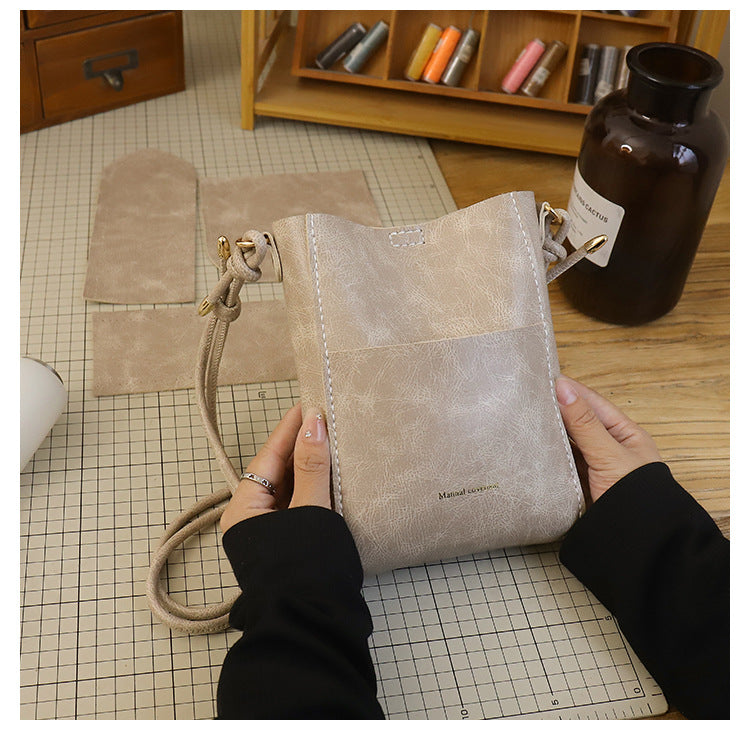 Handmade material bag fashionable and simple solid color bucket messenger bag