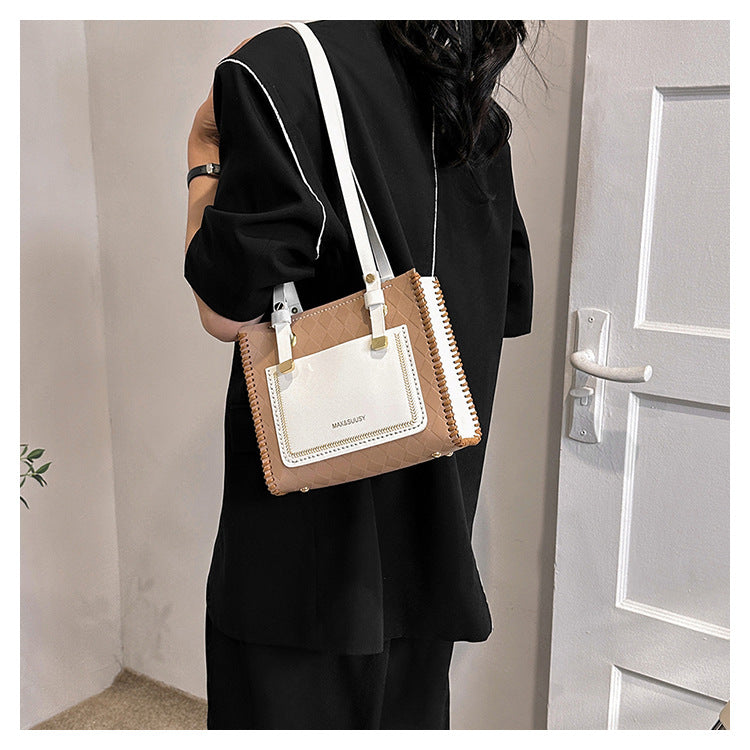 Experience fashion and style with our handmade geometric color-blocked mini bag