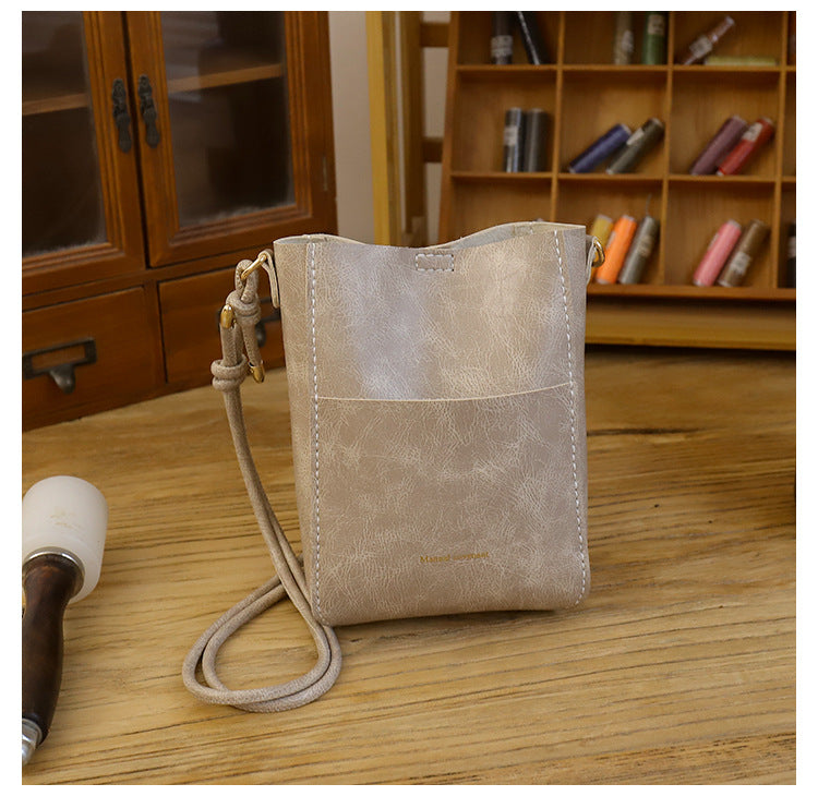 Handmade material bag fashionable and simple solid color bucket messenger bag