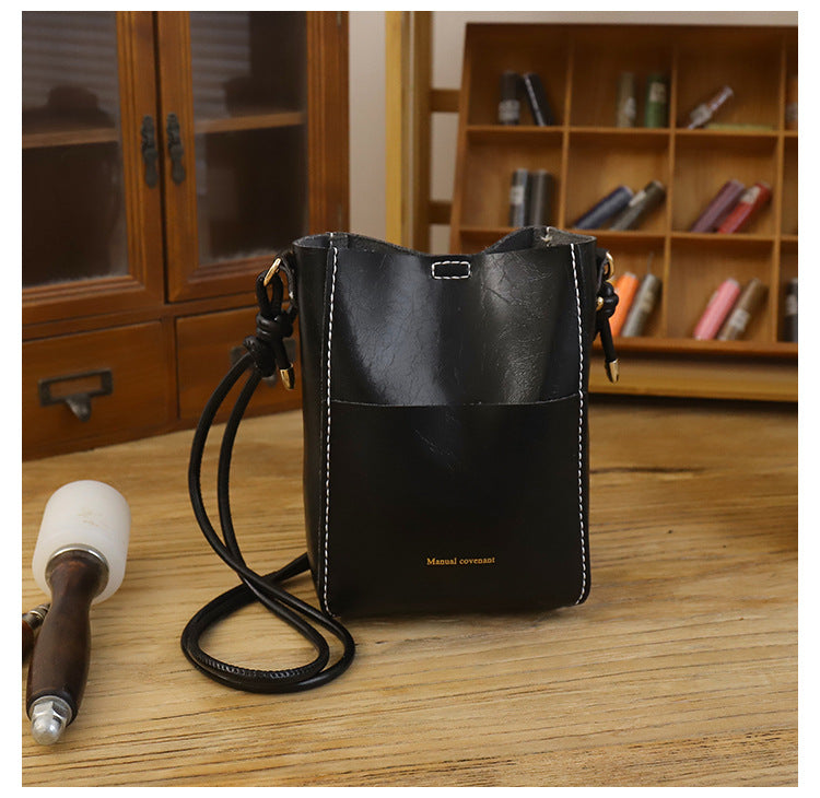 Handmade material bag fashionable and simple solid color bucket messenger bag