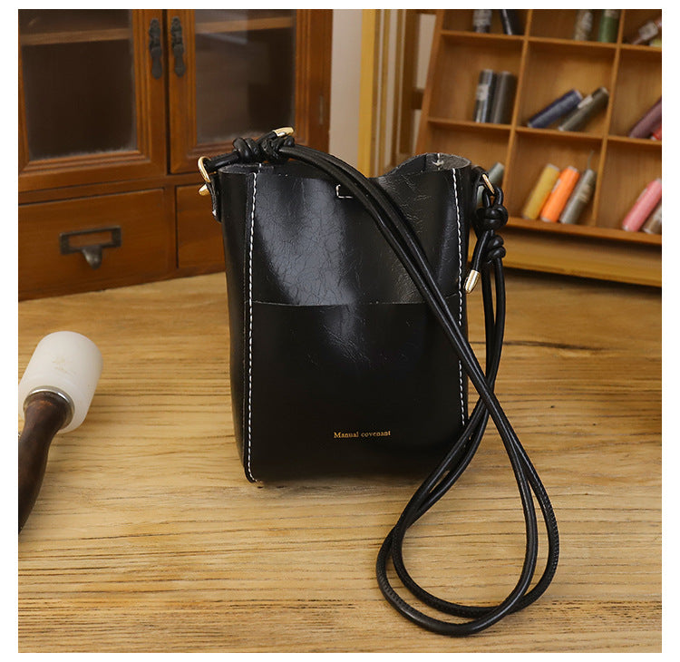 Handmade material bag fashionable and simple solid color bucket messenger bag