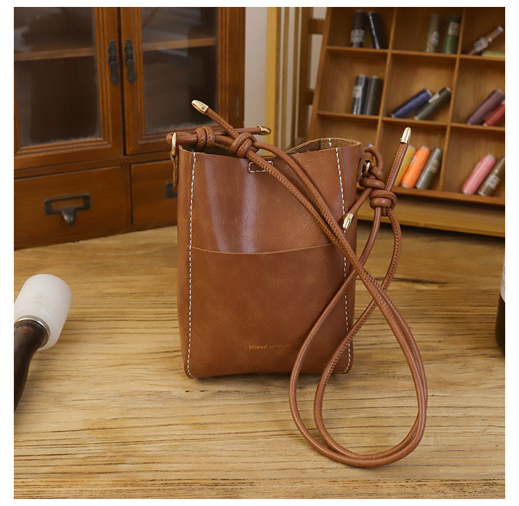 Handmade material bag fashionable and simple solid color bucket messenger bag