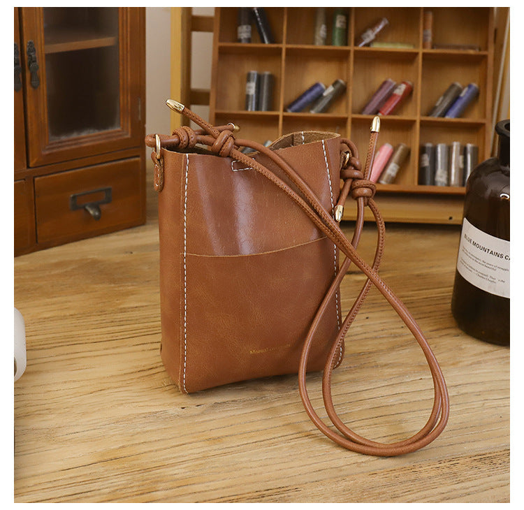 Handmade material bag fashionable and simple solid color bucket messenger bag