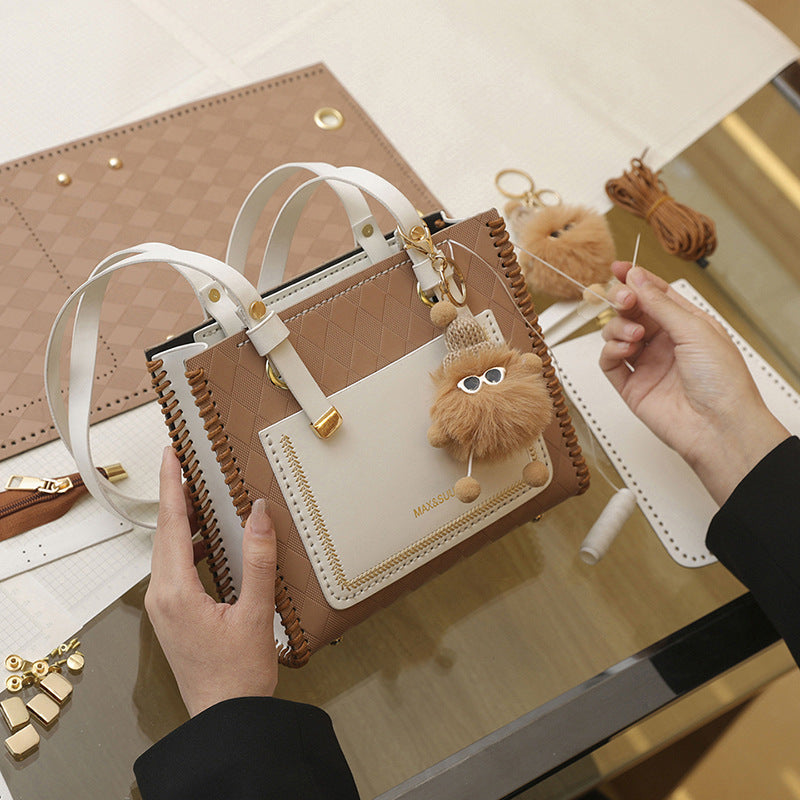 Experience fashion and style with our handmade geometric color-blocked mini bag