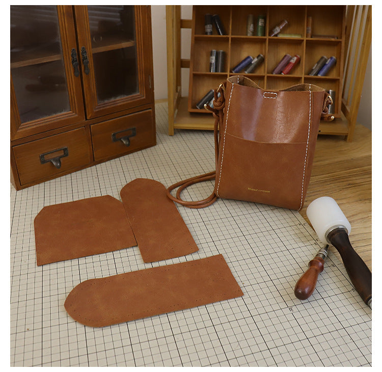 Handmade material bag fashionable and simple solid color bucket messenger bag