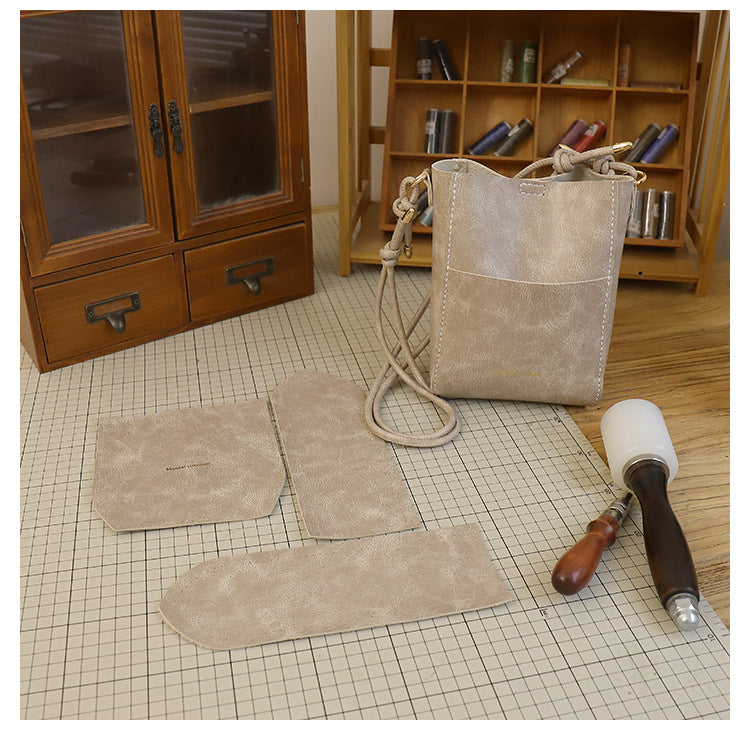 Handmade material bag fashionable and simple solid color bucket messenger bag