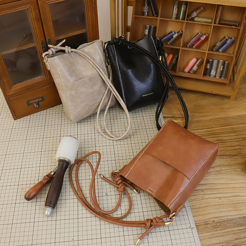Handmade material bag fashionable and simple solid color bucket messenger bag