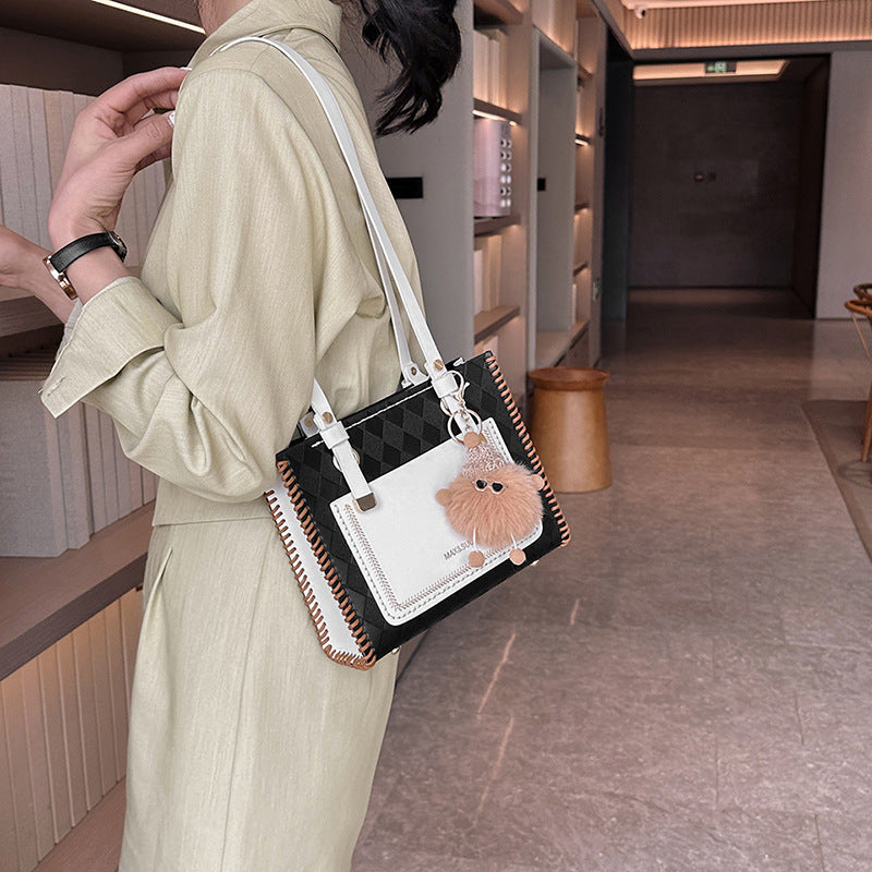 Experience fashion and style with our handmade geometric color-blocked mini bag