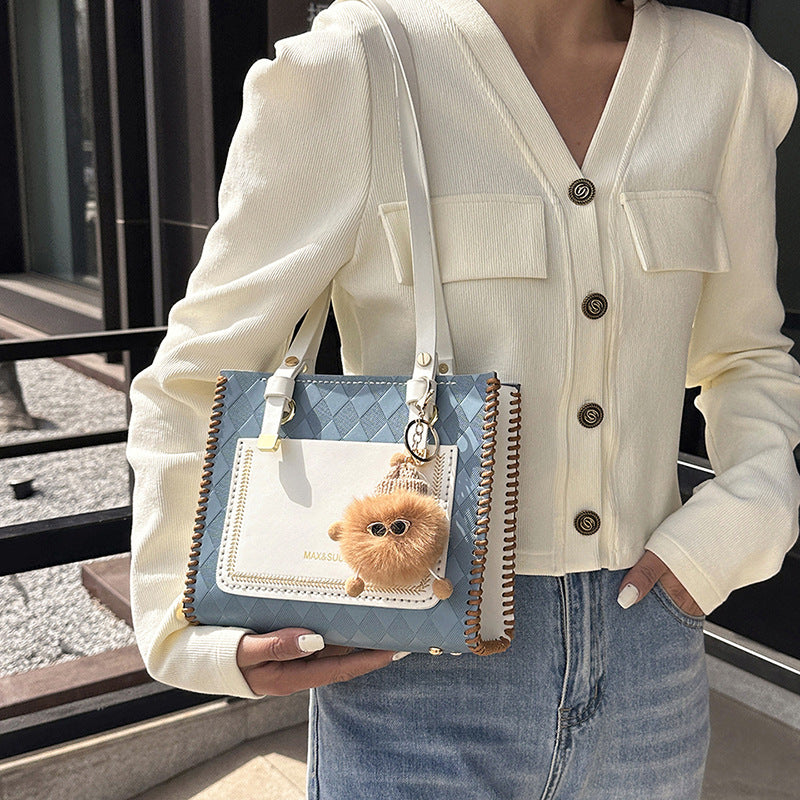 Experience fashion and style with our handmade geometric color-blocked mini bag