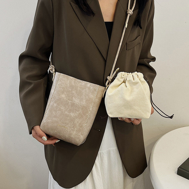 Handmade material bag fashionable and simple solid color bucket messenger bag