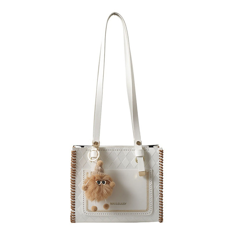 Experience fashion and style with our handmade geometric color-blocked mini bag